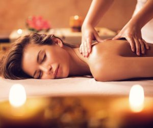 Beautiful woman receiving back massage at the spa.