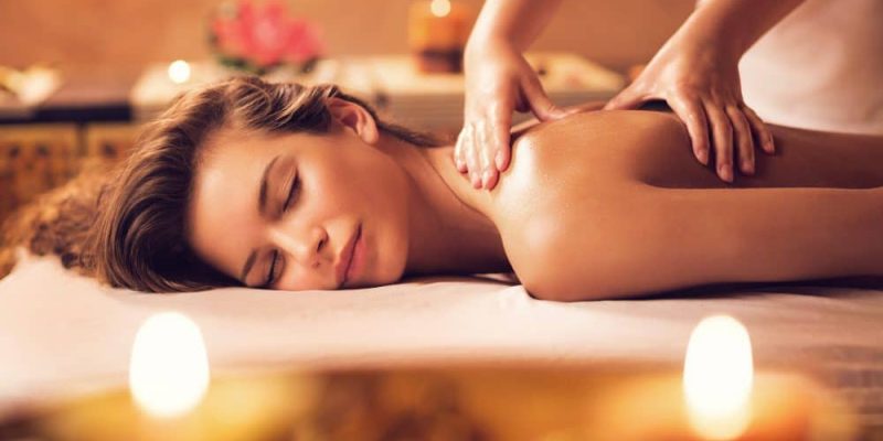 Beautiful woman receiving back massage at the spa.